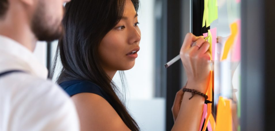 business woman writing on whiteboard