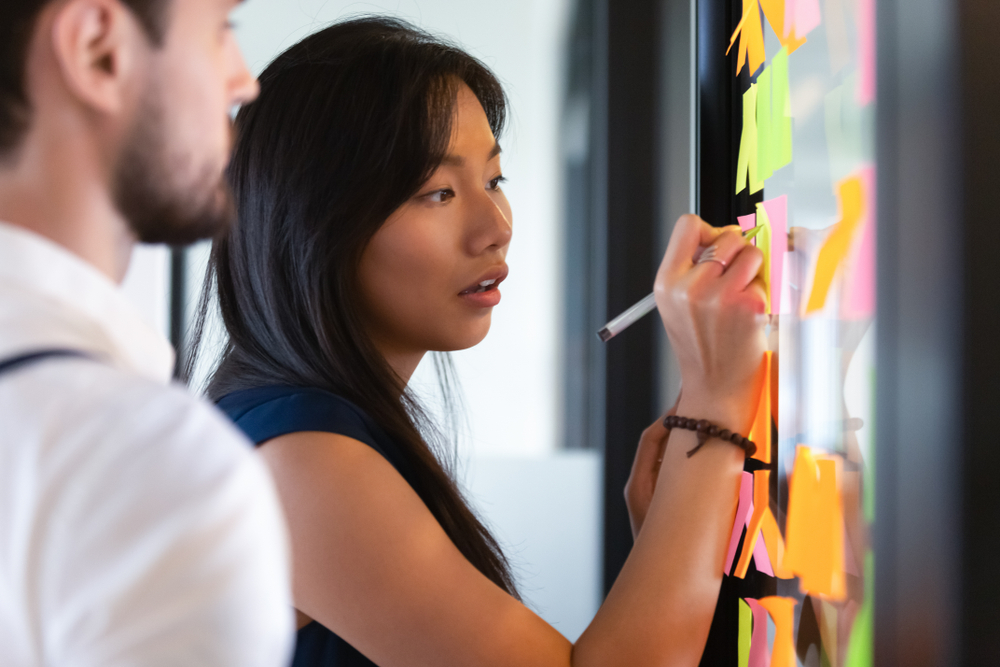 business woman writing on whiteboard