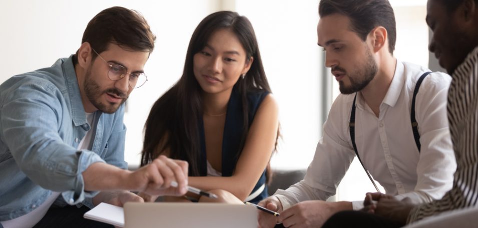 group sitting at computer for instructor led training