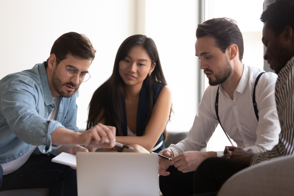 group sitting at computer for instructor led training